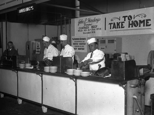 John P. Harding's famous corned beef sandwiches are sold at a booth at the Food Show, circa 1925. (Chicago Herald and Examiner)