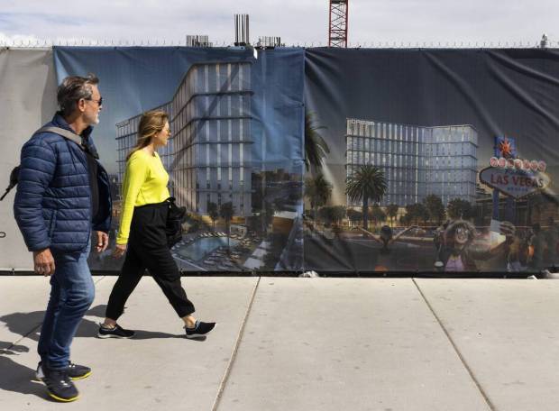 Pedestrian walk past a rendering of the Dream Las Vegas hotel-casino at the construction site at 5051 Las Vegas Blvd. South, on Wednesday March 15, 2023., in Las Vegas. (Bizuayehu Tesfaye/Las Vegas Review-Journal) @btesfaye