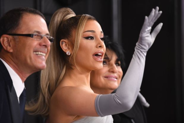 US singer-songwriter Ariana Grande arrives with her parents Joan Grande and Edward Butera for the 62nd Annual Grammy Awards on January 26, 2020, in Los Angeles. (Photo by VALERIE MACON / AFP) (Photo by VALERIE MACON/AFP via Getty Images)