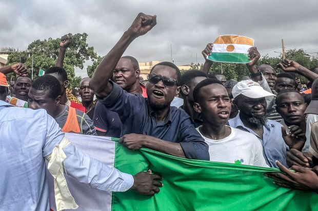 TOPSHOT - Protesters gesture during a demonstration on independence day in Niamey on August 3, 2023. Security concerns built on August 3, 2023 ahead of planned protests in coup-hit Niger, with France demanding safety guarantees for foreign embassies as some Western nations reduced their diplomatic presence. (Photo by AFP) (Photo by -/AFP via Getty Images)