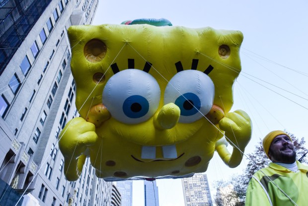 NEW YORK, NEW YORK - NOVEMBER 23: The Spond Bob Squarepants balloon floats in Macy's annual Thanksgiving Day Parade on November 23, 2023 in New York City. Thousands of people lined the streets to watch the 25 balloons and hundreds of performers march in this parade happening since 1924. (Photo by Stephanie Keith/Getty Images)