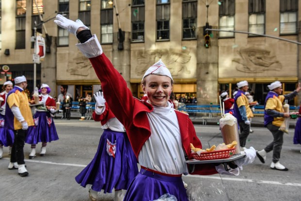 NEW YORK, NEW YORK - NOVEMBER 23: People participate in Macy's annual Thanksgiving Day Parade on November 23, 2023 in New York City. Thousands of people lined the streets to watch the 25 balloons and hundreds of performers march in this parade happening since 1924. (Photo by Stephanie Keith/Getty Images)