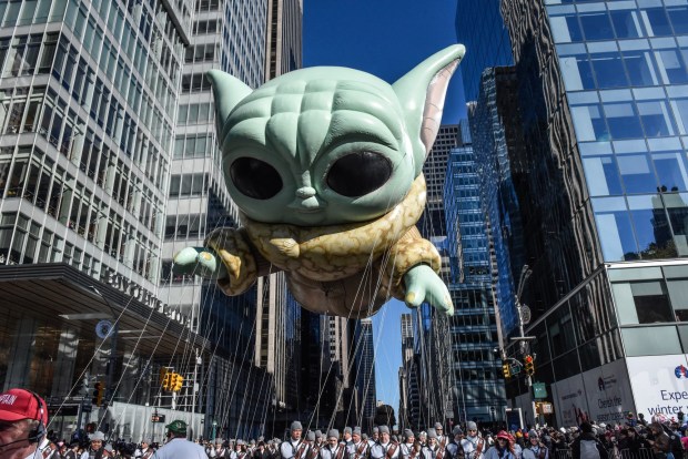 NEW YORK, NEW YORK - NOVEMBER 23: The Grogu balloon floats in Macy's annual Thanksgiving Day Parade on November 23, 2023 in New York City. Thousands of people lined the streets to watch the 25 balloons and hundreds of performers march in this parade happening since 1924. (Photo by Stephanie Keith/Getty Images)