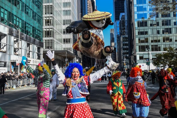 NEW YORK, NEW YORK - NOVEMBER 23: People participate in Macy's annual Thanksgiving Day Parade on November 23, 2023 in New York City. Thousands of people lined the streets to watch the 25 balloons and hundreds of performers march in this parade happening since 1924. (Photo by Stephanie Keith/Getty Images)