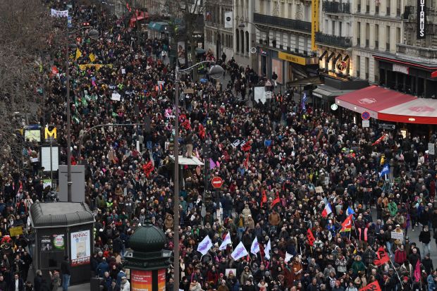 Protesters march during a rally on a second day of nationwide strikes and protests over the government's proposed pension reform, in Paris on January 31, 2023. - France braces for major transport blockages, with mass strikes and protests set to hit the country for the second time in a month in objection to the planned boost of the age of retirement from 62 to 64. On January 19, some 1.1 million voiced their opposition to the proposed shake-up -- the largest protests since the last major round of pension reform in 2010. (Photo by Alain JOCARD / AFP) (Photo by ALAIN JOCARD/AFP via Getty Images)