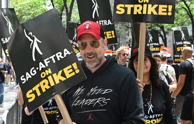 US actor Jason Sudeikis joins members of the Writers Guild of America and the Screen Actors Guild as they walk a picket line on Day 1 outside NBC Universal in New York City on July 14, 2023. Tens of thousands of Hollywood actors went on strike at midnight July 13, 2023, effectively bringing the giant movie and television business to a halt as they join writers in the first industry-wide walkout for 63 years. (Photo by TIMOTHY A. CLARY / AFP) (Photo by TIMOTHY A. CLARY/AFP via Getty Images)