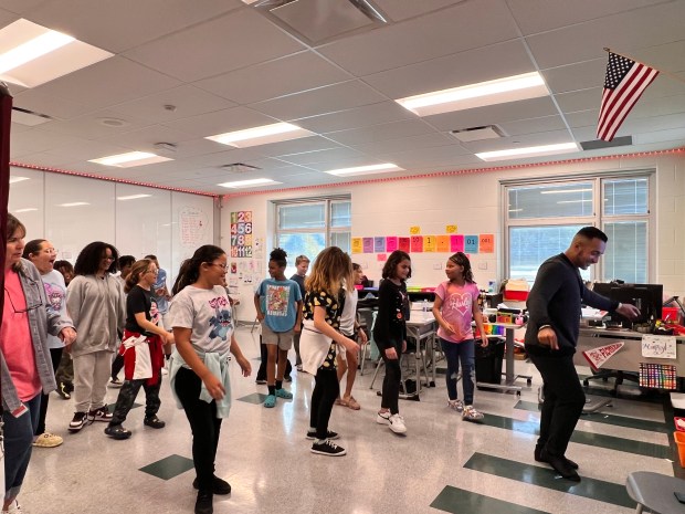 Students partake in learning Latin dances from community volunteer Alonso Southard, owner of The Dance Kitchen. (Lauren Hoffman -- The Morning Journal)