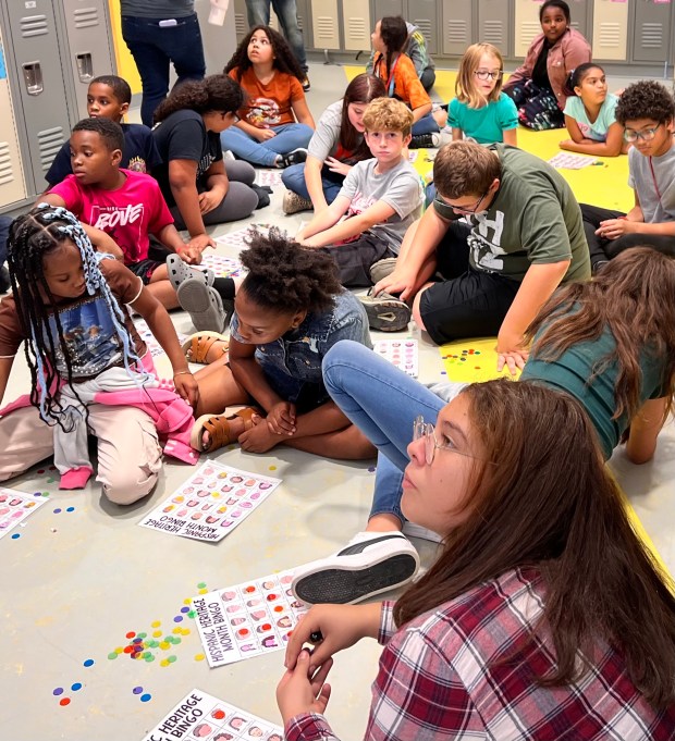 A student waits anxiously for the next phrase to be called out during Latin bingo Oct. 6. During the bingo, students participated in a chance to win Spanish candies. (Lauren Hoffman -- The Morning Journal)