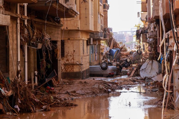 TOPSHOT - Overturned cars lay among other debris caused by flash floods in Derna, eastern Libya, on September 11, 2023. Flash floods in eastern Libya killed more than 2,300 people in the Mediterranean coastal city of Derna alone, the emergency services of the Tripoli-based government said on September 12. (Photo by AFP) (Photo by -/AFP via Getty Images)