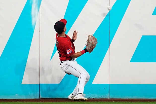 Steven Kwan watches a ball hit for a double by the Twins' Kyle Farmer bounce off the outfield wall in the sixth inning Sept. 5. (Sue Ogrocki - The Associated Press)