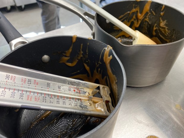 Pans covered in caramel by Jeff Morsfield, after a recent pour. (Frank Mecham- The News-Herald.)