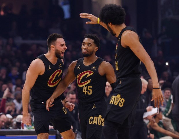 Max Strus, Donovan Mitchell and Jarrett Allen celebrate during the Cavaliers' victory over the Bucks on Jan. 17. (Tim Phillis - For The News-Herald)