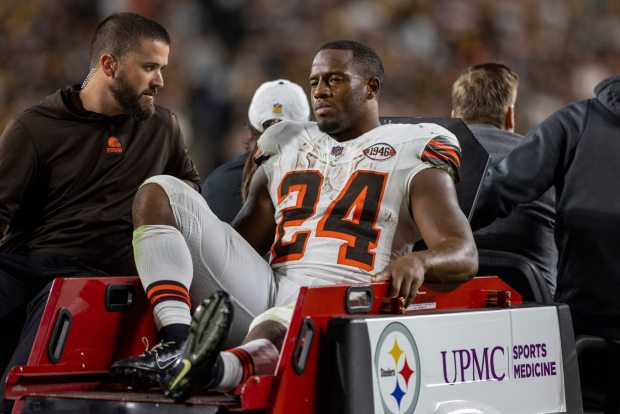 Nick Chubb is carted off the field after being injured Sept. 18, in Pittsburgh. (Matt Durisko - The Associated Press)