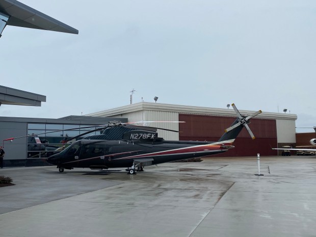 A Sikorsky S-76 part of Flexjet's helicopter program sits on the tarmac.