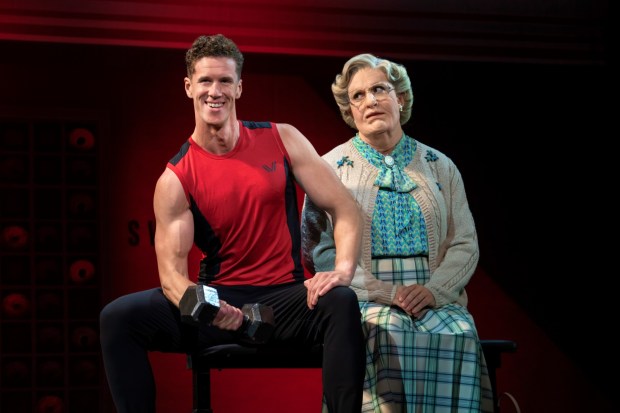 In "Mrs. Doubtfire," Daniel Hilliard - portrayed by Rob McClure, left, as alter ego Mrs. Doubtfire - burns calories attempting to steer the strong-and-tall Stuart Dunmire, played by Leo Roberts, from pursuing Daniel's ex-wife romantically. (Joan Marcus)