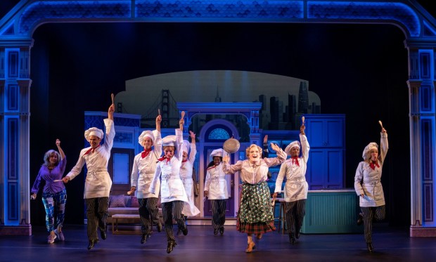 Rob McClure, center, as Mrs. Doubtfire, and the ensemble of "Mrs. Doubtfire" perform a musical number revolving around the titular character seeking help in the kitchen. (Joan Marcus)